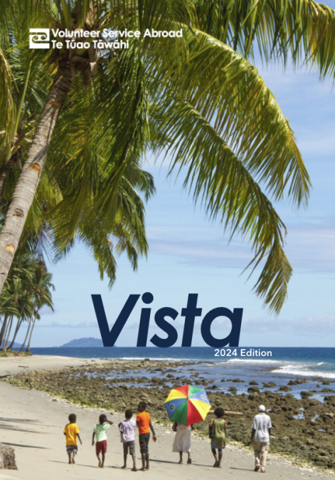 Magazine cover showing a photo of a group of people on the beach and some text